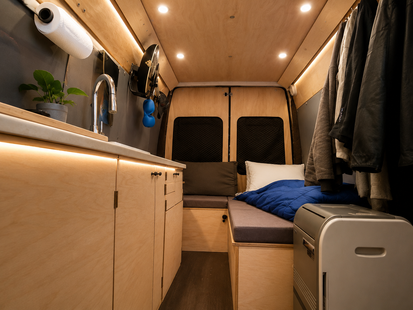 Interior of a 2006 Sprinter with a full size countertop galley and marine-grade 12V electrical system